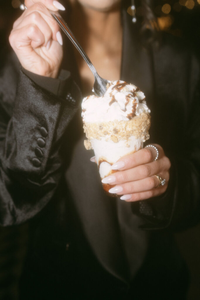 Bride digging into her CrazyShake during her Venetian wedding reception at Black TaP