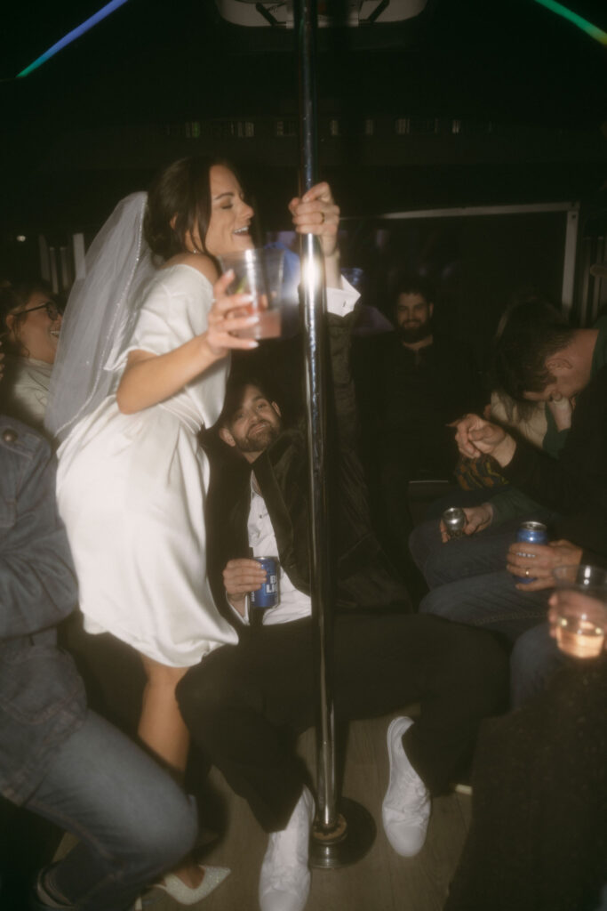 Bride and groom dancing on the party bus