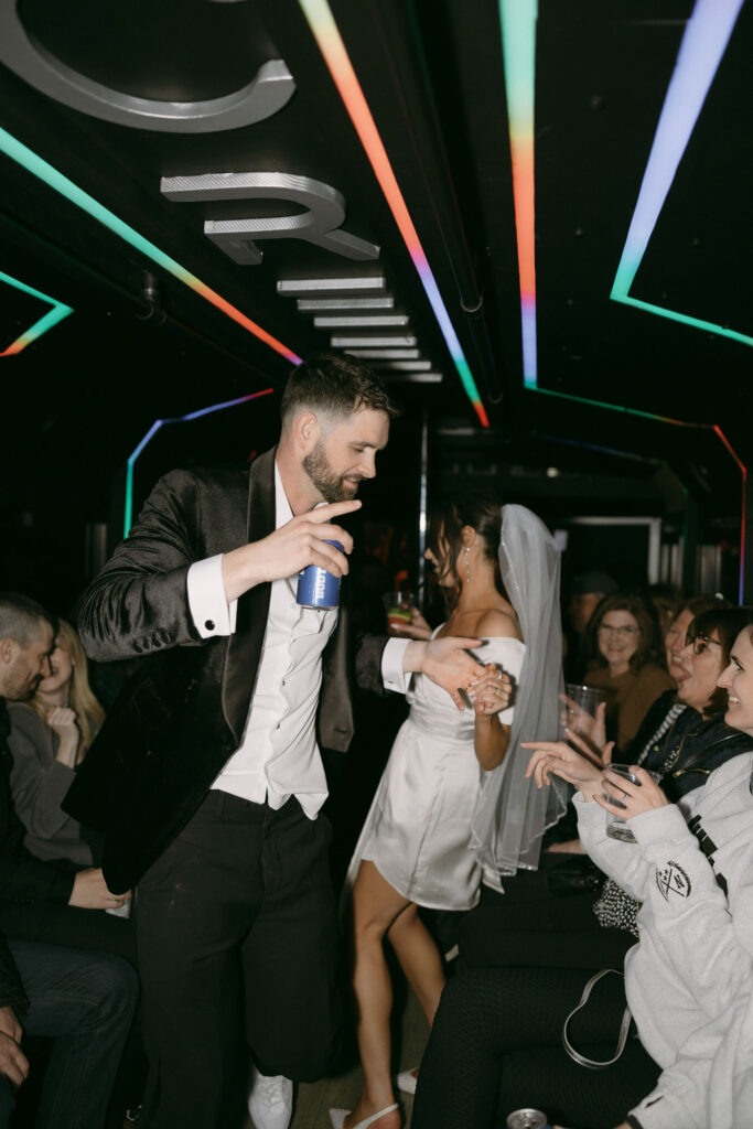 Bride and groom dancing on the party bus