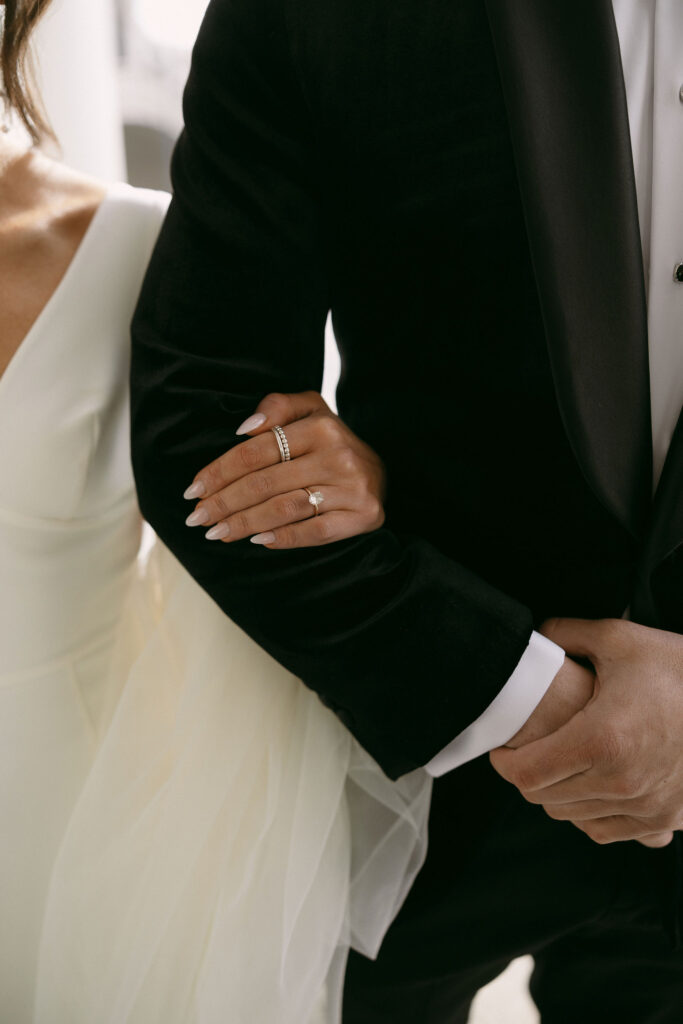 Bride holding onto her grooms arm