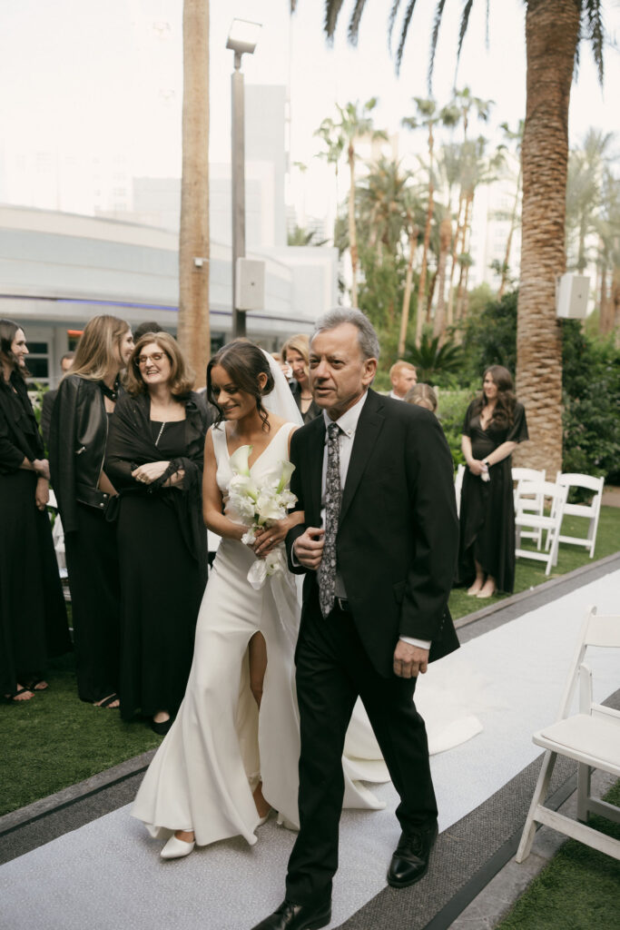 Bride being walked down the aisle by her father