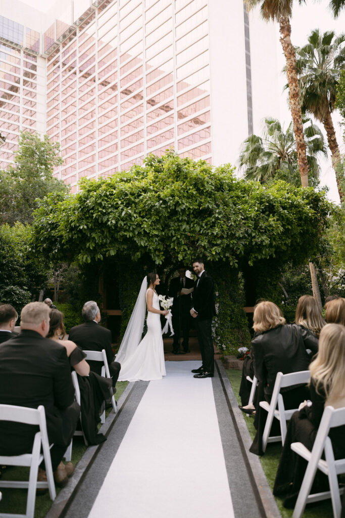 Bride and groom at the altar during their Flamingo Gazebo wedding ceremony in Las Vegas