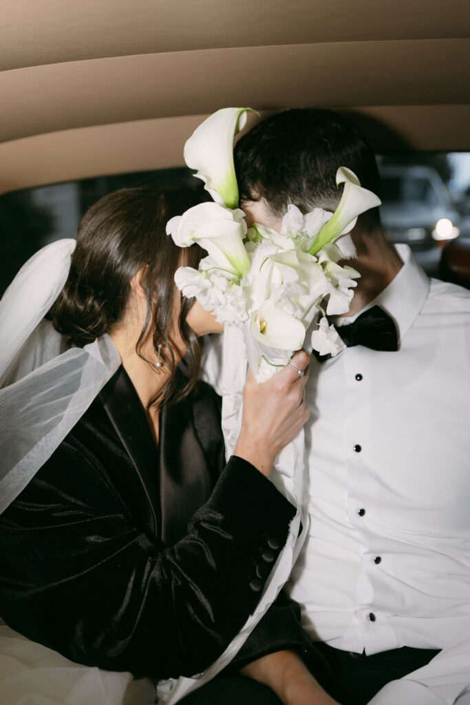 Bride and grooms flash wedding portraits in a Rolls-Royce for their Las Vegas wedding