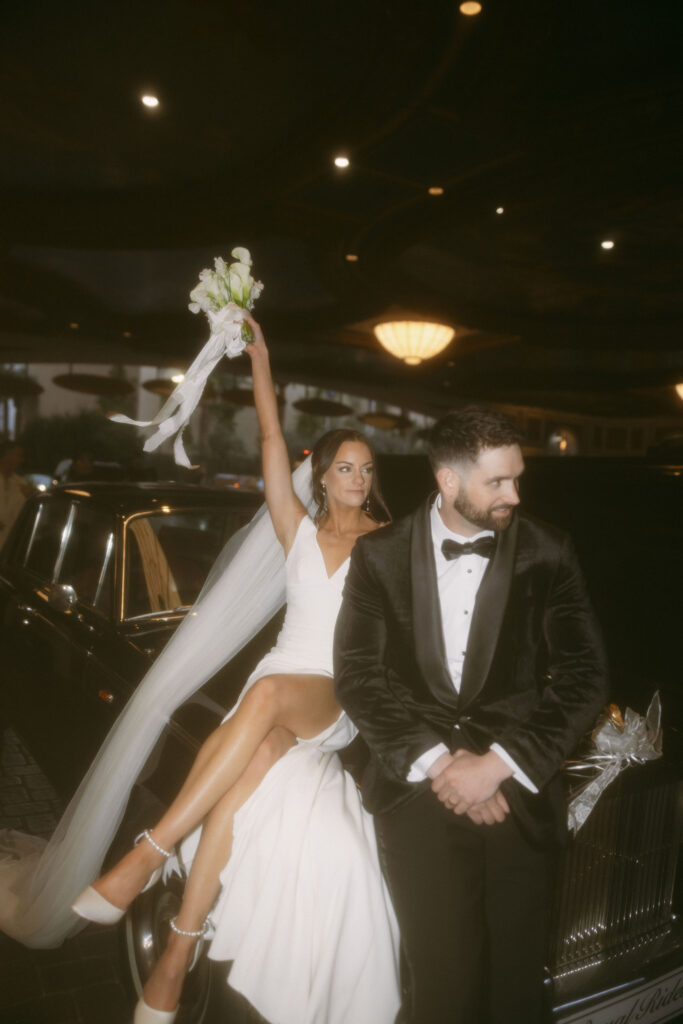 Bride and grooms flash wedding portraits in a Rolls-Royce for their Las Vegas wedding