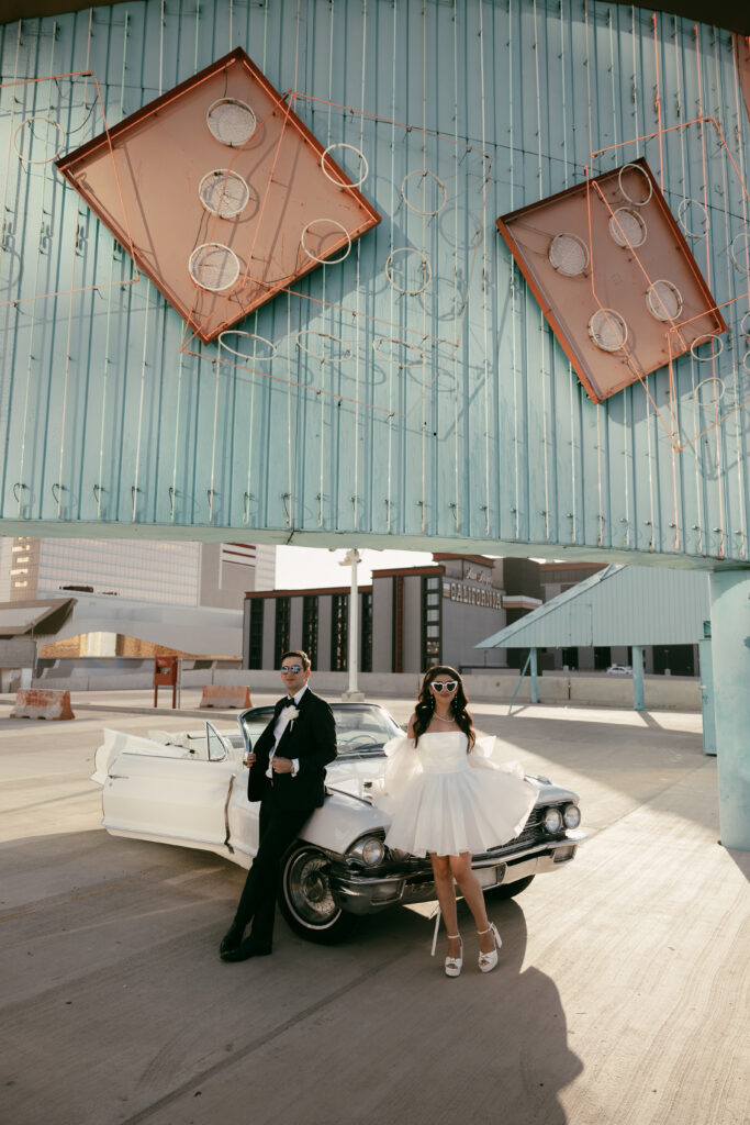 Bride and groom posing on top of a rooftop for their Las Vegas elopement