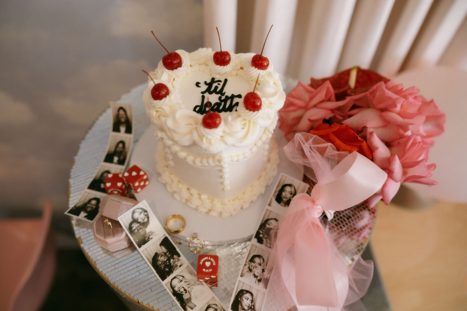 Las Vegas elopement details with flowers, a cake, and film photos