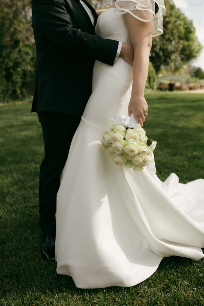 Bride and grooms outdoor portraits in the Secret Garden at Madonna Inn wedding venue in California