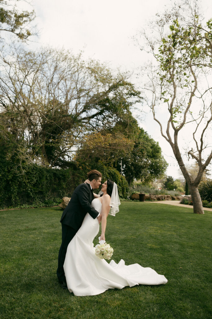 Bride and grooms outdoor portraits in the Secret Garden at Madonna Inn wedding venue in California
