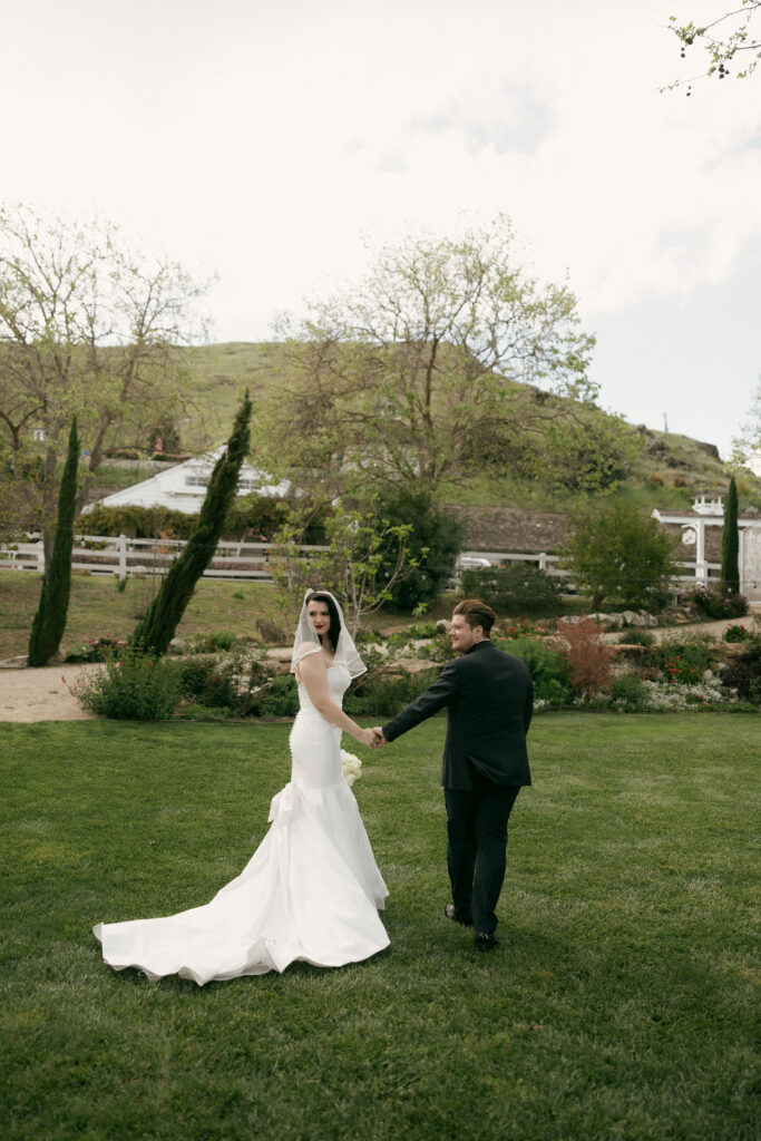 Bride and grooms outdoor portraits in the Secret Garden at Madonna Inn wedding venue in California