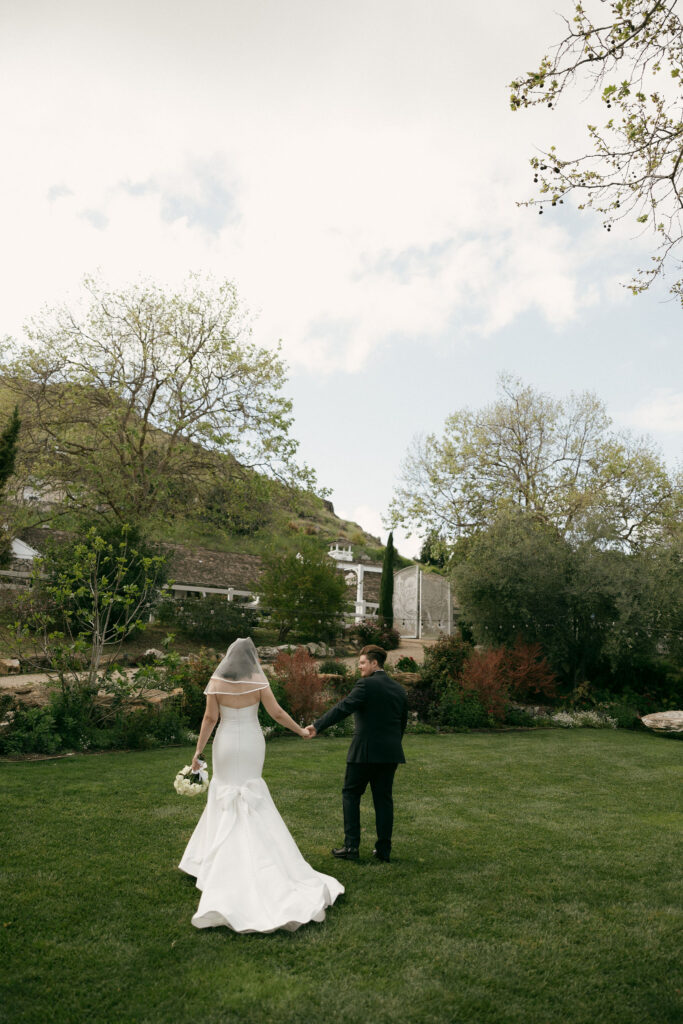 Bride and grooms outdoor portraits in the Secret Garden at Madonna Inn wedding venue in California
