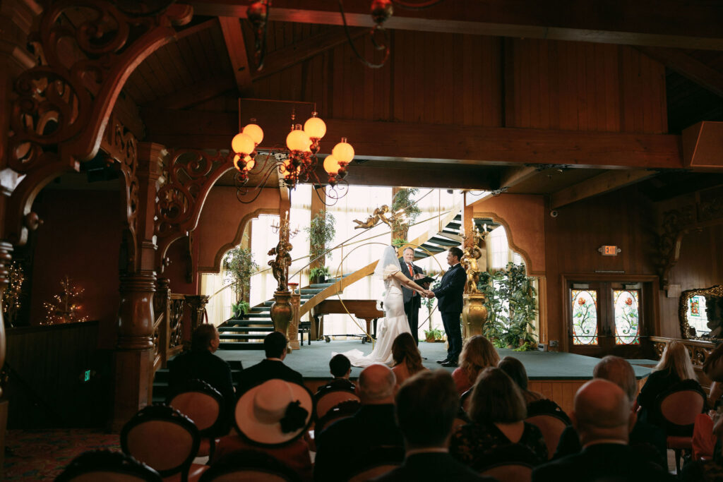 Bride and grooms Madonna Inn wedding ceremony on The Main Dance Floor