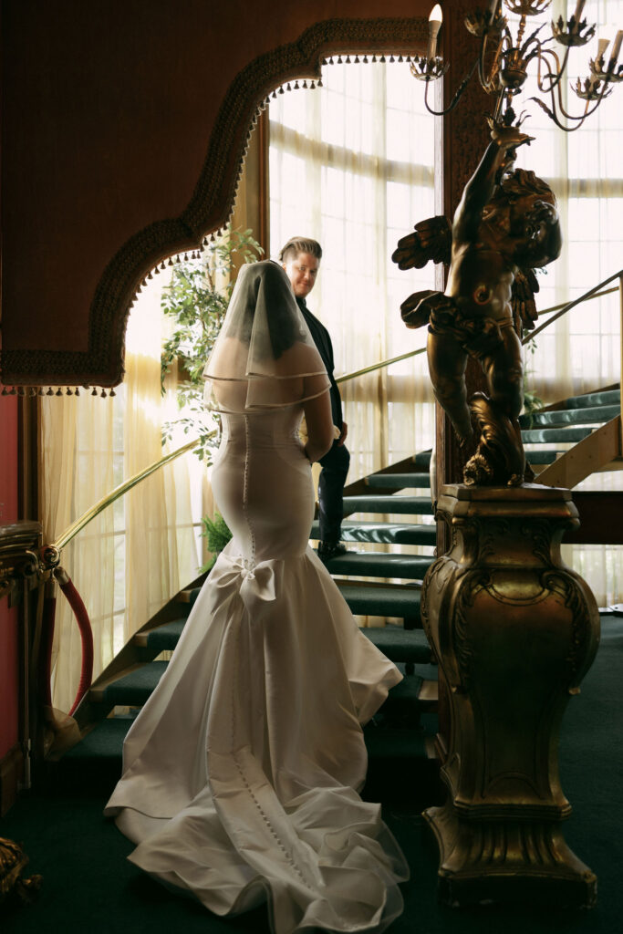 Bride and grooms portraits on the staircase at Madonna Inn wedding venue in California