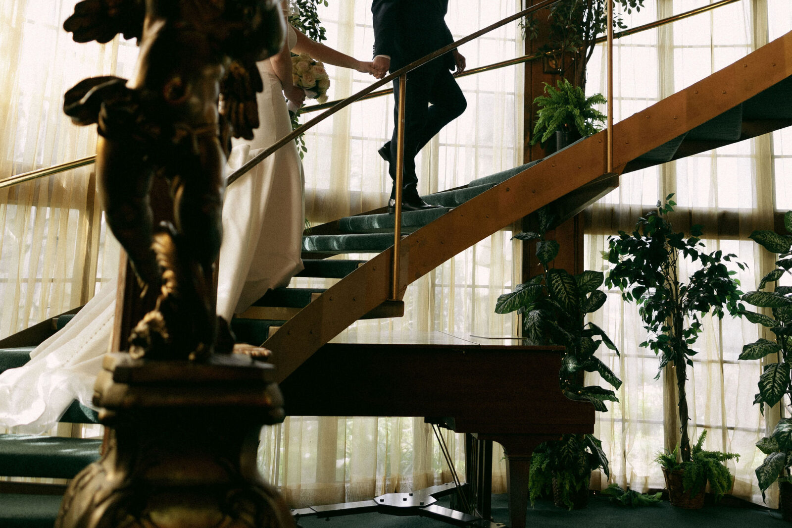 Bride and grooms portraits on the staircase at Madonna Inn wedding venue in California