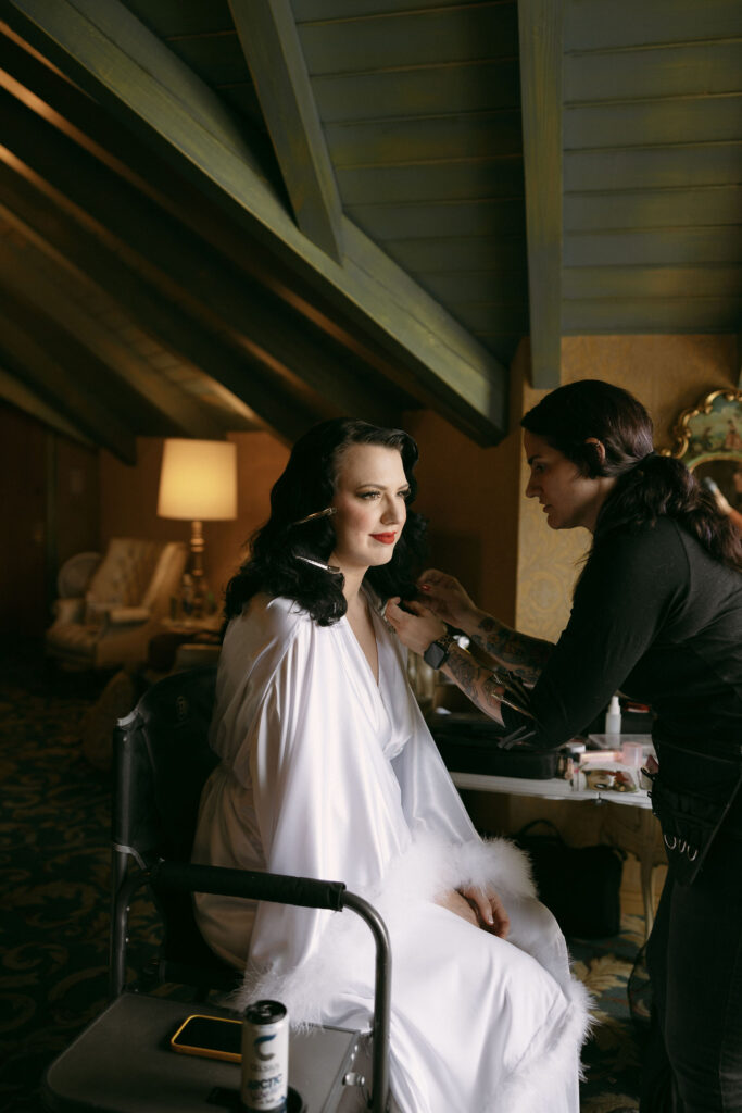 Bride getting her hair and makeup done by Vintage Vixen Vanity