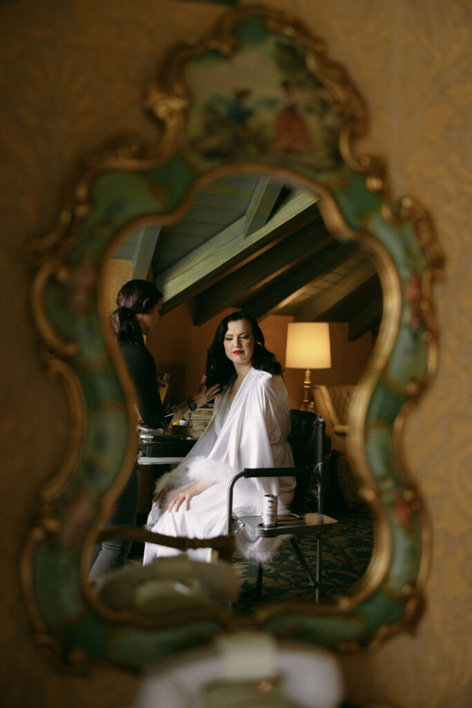 Bride getting her hair and makeup done by Vintage Vixen Vanity