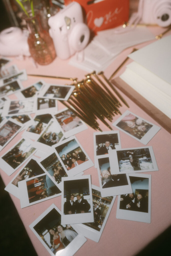 Polaroids on a wedding reception table