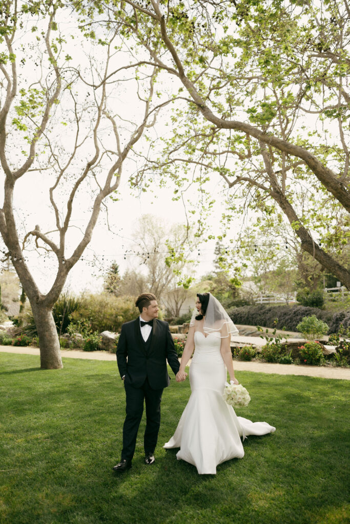 Bride and grooms outdoor portraits in the Secret Garden at Madonna Inn wedding venue in California