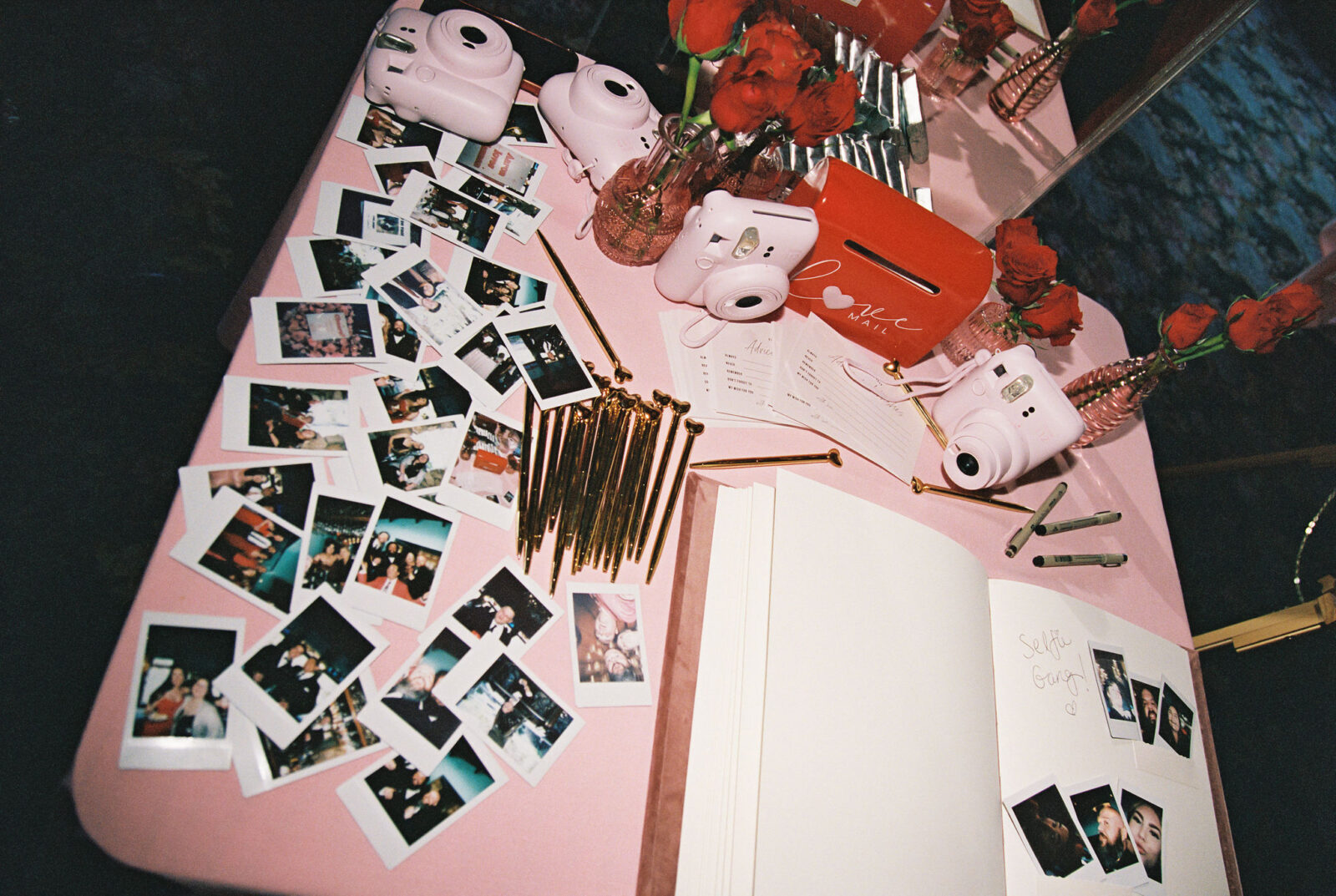 Polaroid table at a wedding reception captured on film
