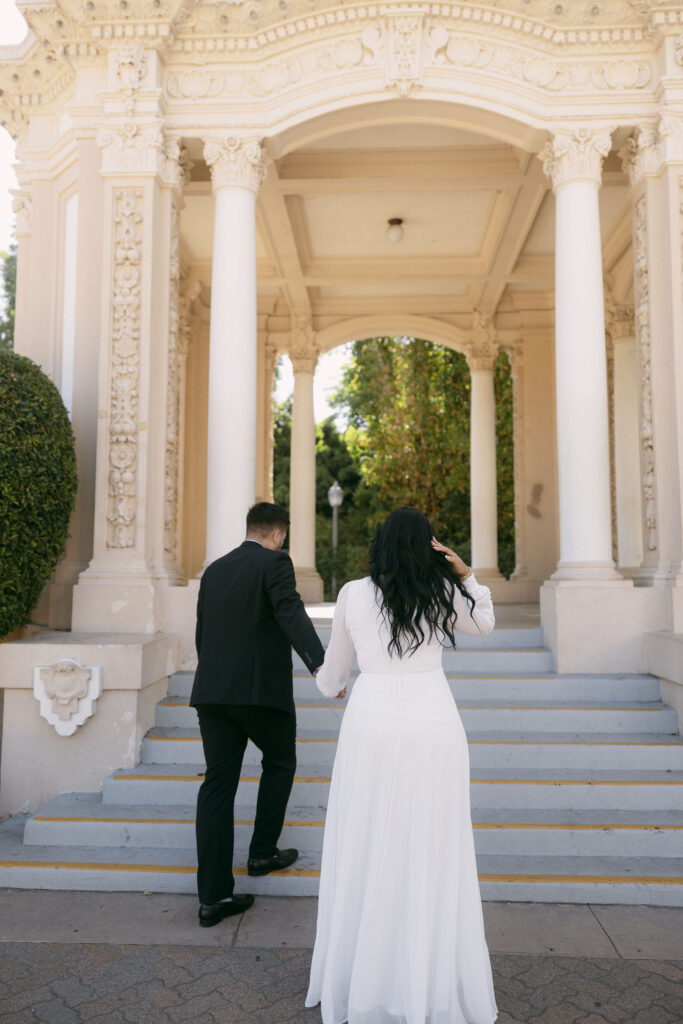 Couple walking up the steps of the Speckles Organ Pavilion