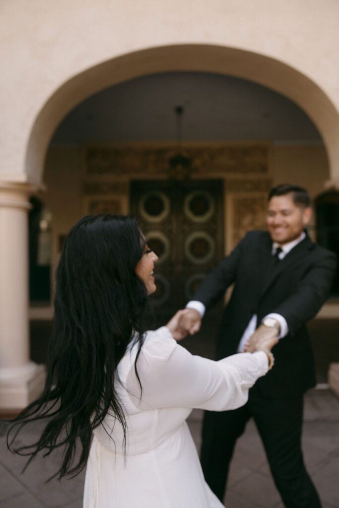 Man and woman spinning together in a circle