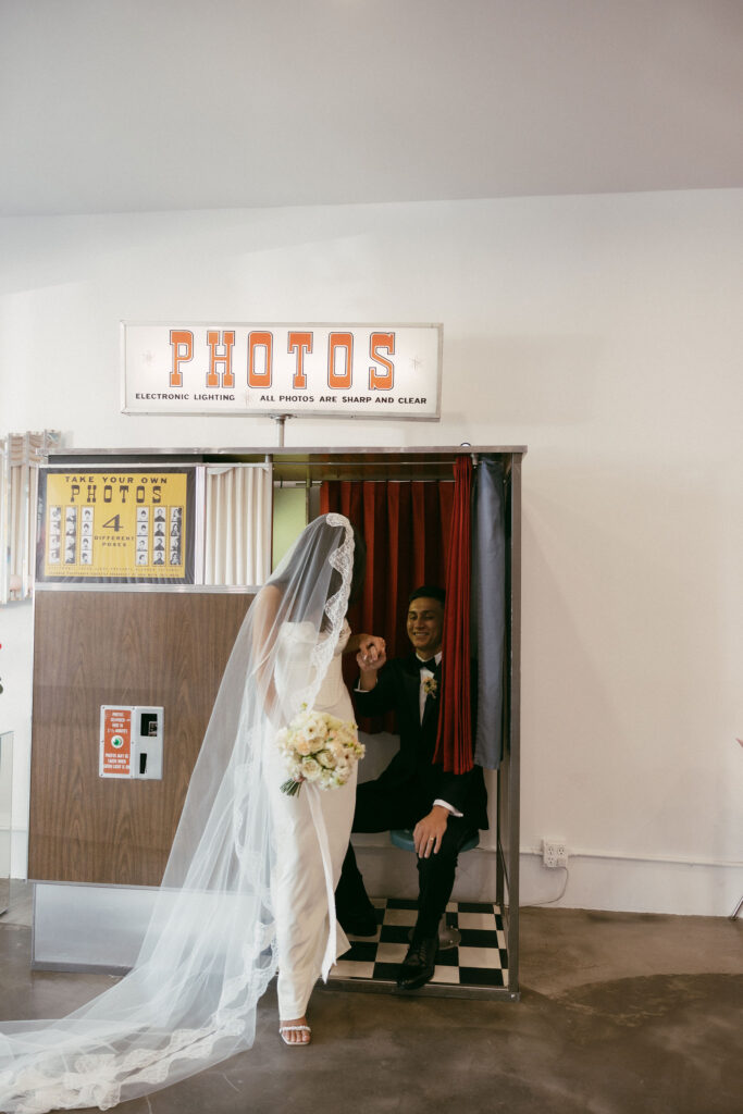 Digital photo of a bride and groom posing in Sure Thing Chapels vintage photo booth