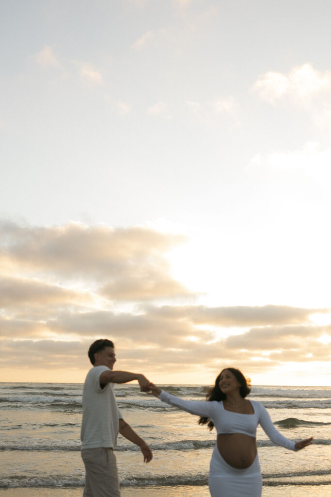 Documentary San Diego maternity photos on the beach during sunset