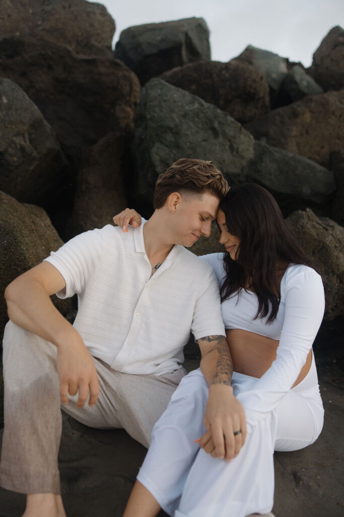 Man and woman sitting together on the beach