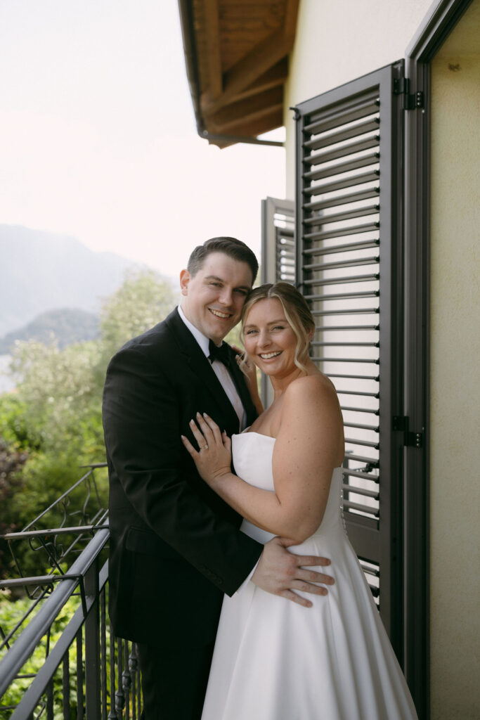 Outdoor bride and grooms portraits on the balcony of their Lake Como Airbnb