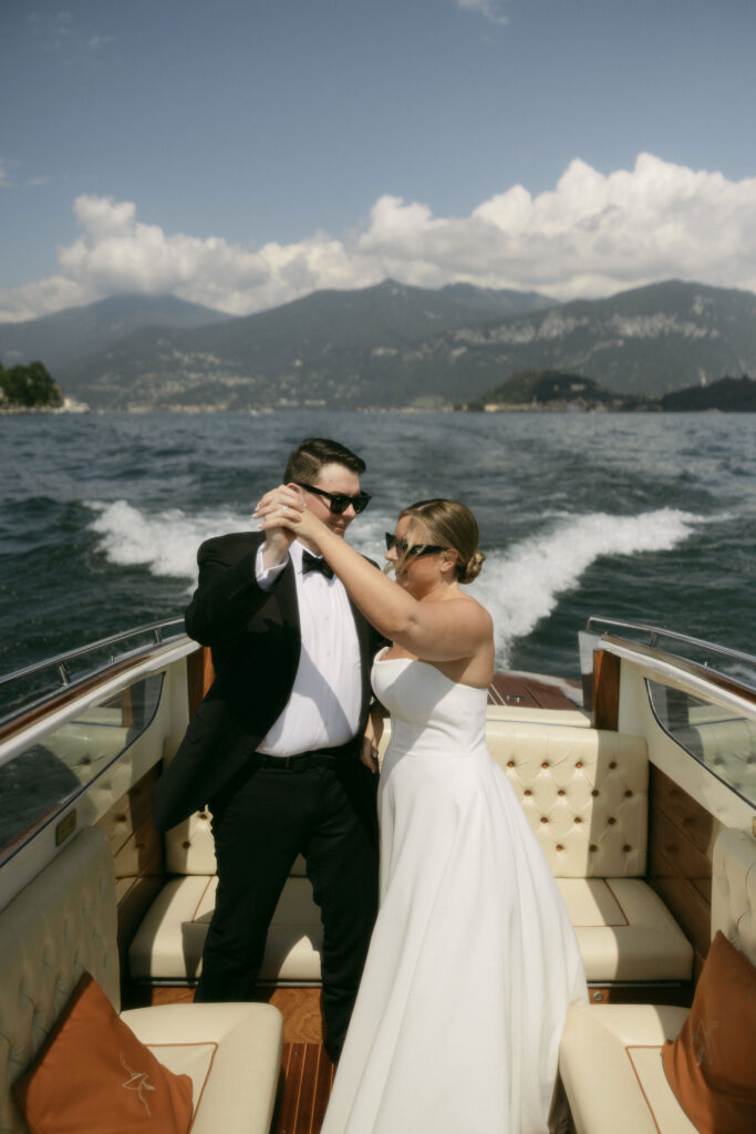 Bride and groom dancing on a boat during their Lake Como elopement