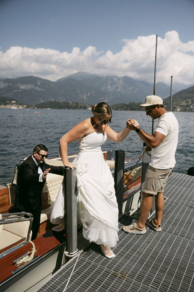 Bride and groom getting off their Lake Como boat