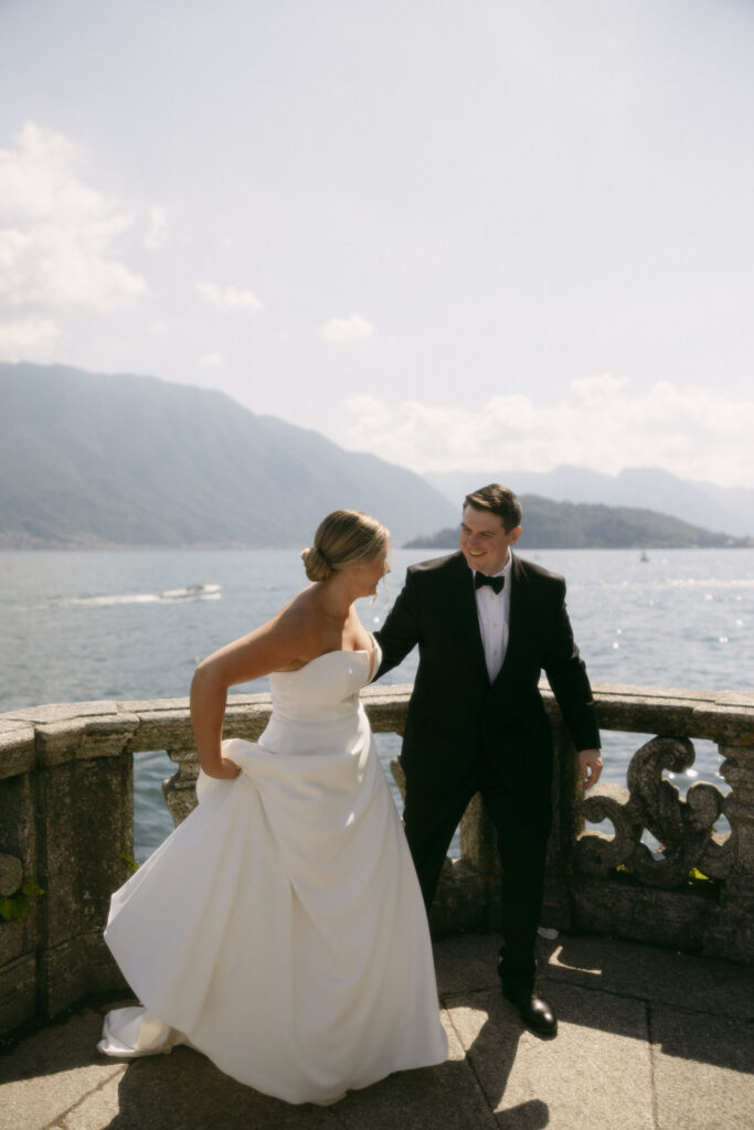 Bride and groom posing in Lake Como, Italy