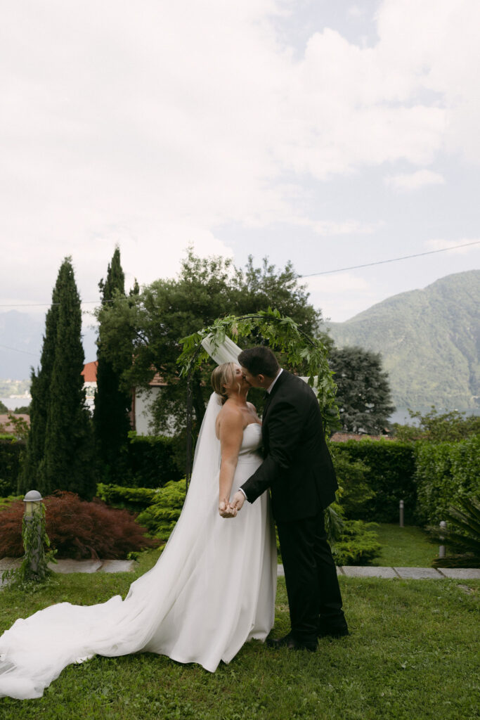 Bride and groom kissing during their outdoor elopement ceremony