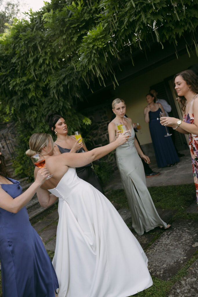 Bride toasting drinks with guests