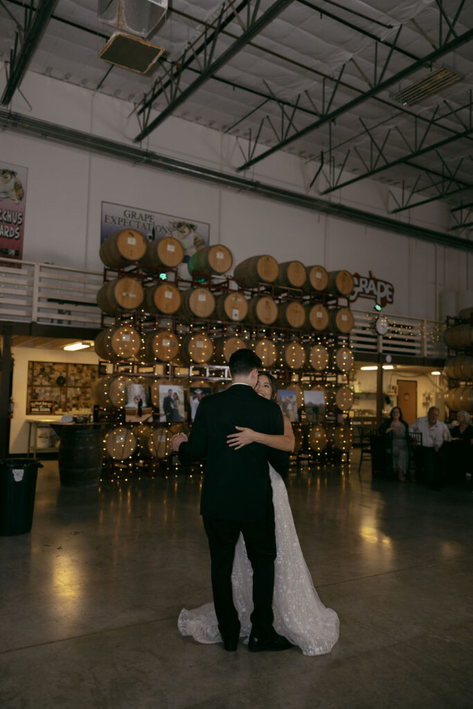 Bride and groom sharing a first dance during their indoor wedding reception at Grape Expectations in Las Vegas