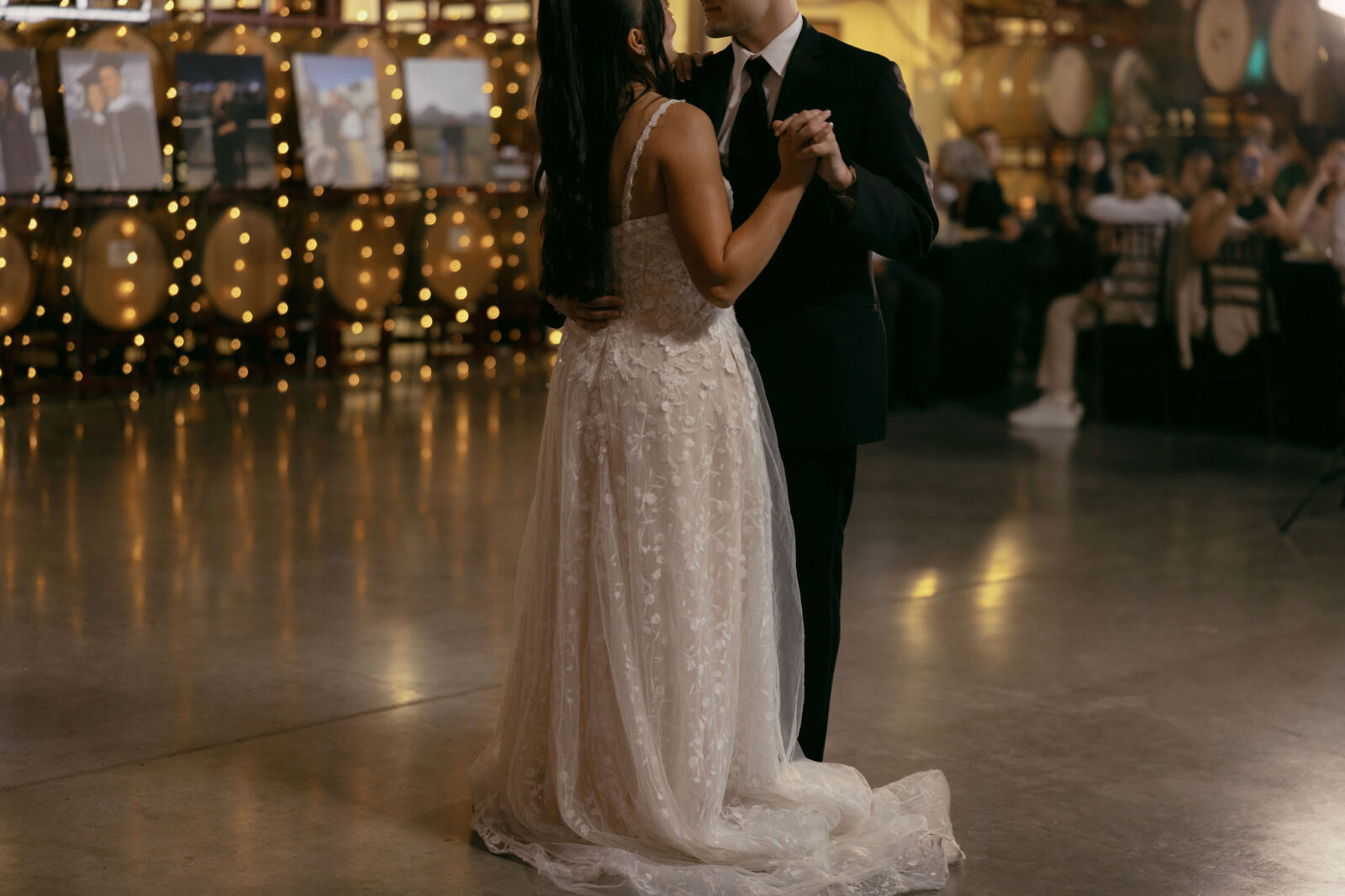 Bride and groom sharing a first dance during their indoor wedding reception at Grape Expectations in Las Vegas