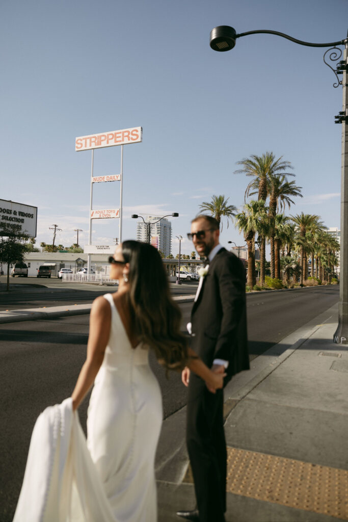 Bride and groom walking down the street in Las Vegas