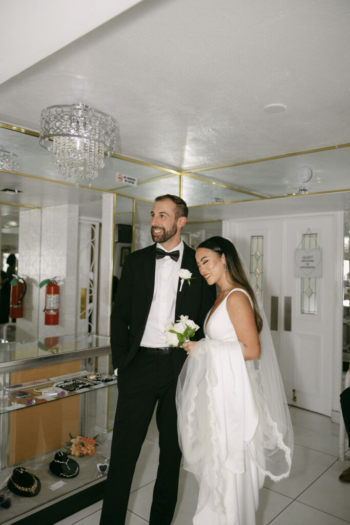 Bride and groom waiting in The Little White Chapels waiting room