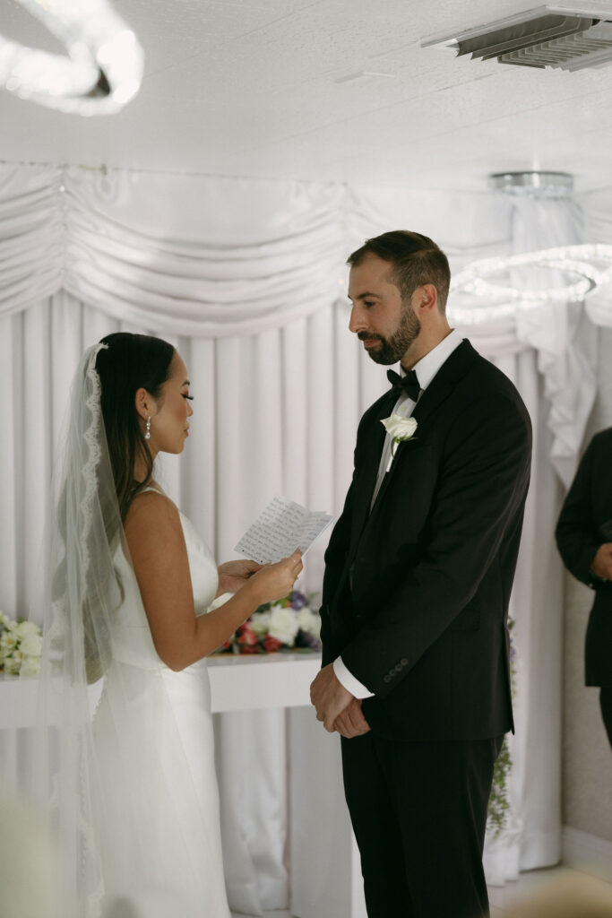 Bride reading her vows to her groom