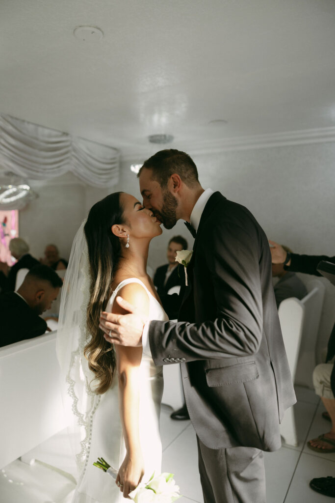 Bride and groom kissing after their Little White Chapel elopement ceremony