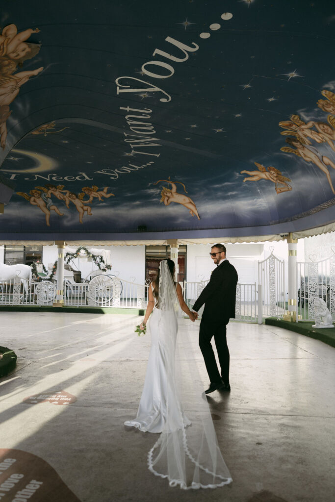 Bride and groom walking in The Tunnel of Love