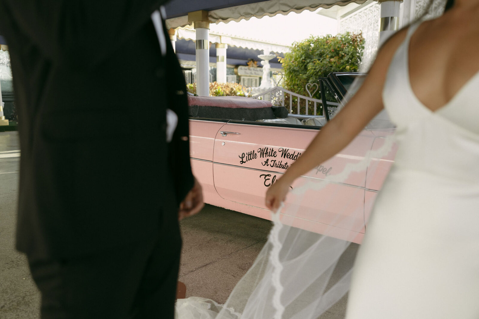 Editorial Las Vegas elopement portraits with The Pink Cadillac at Little White Chapel