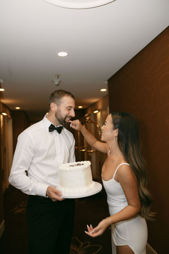 Bride and groom eating cake from Mary's Cakes at Wynn Las Vegas