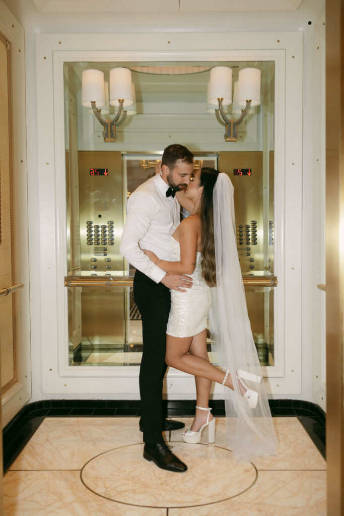 Bride and groom kissing in Wynn Las Vegas elevator