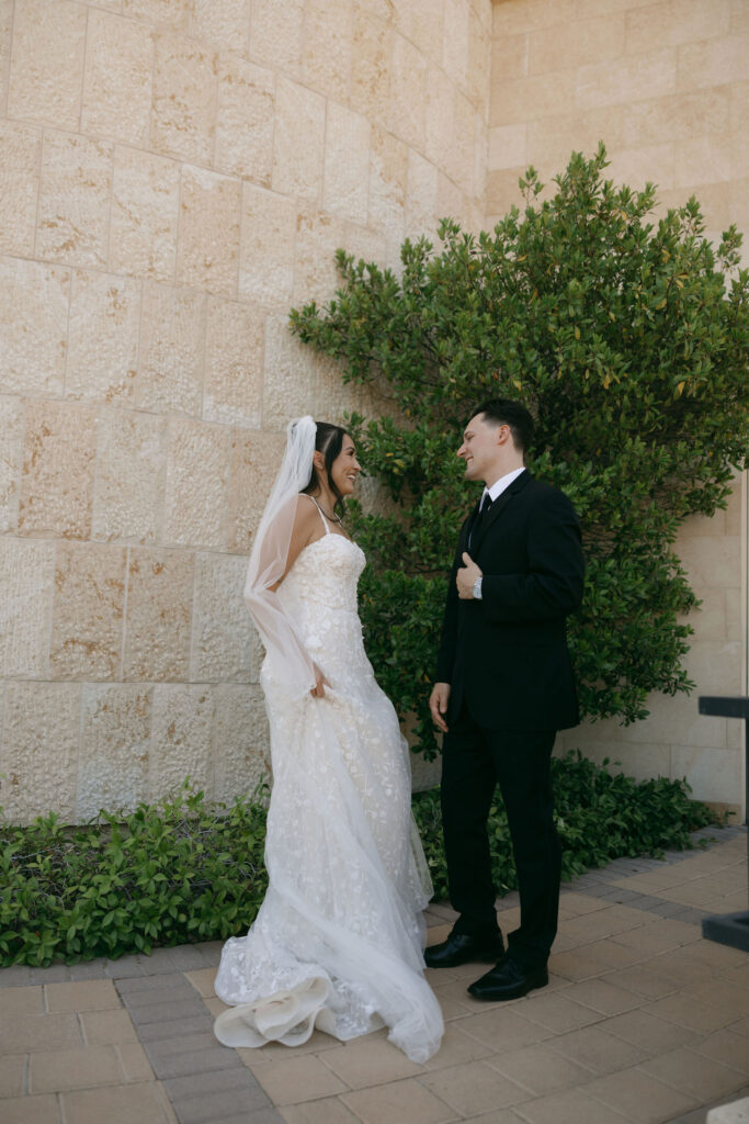 Bride and groom talking during their first look