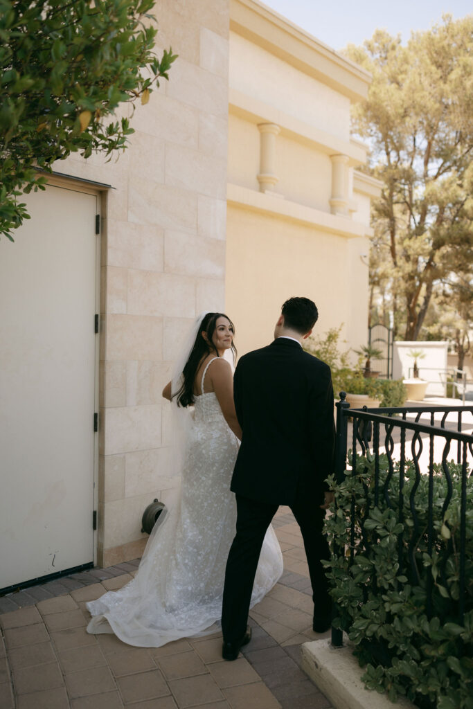 Bride and groom walking and holding hands