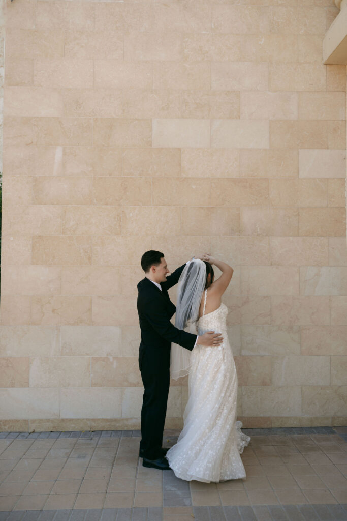 Groom twirling his bride during portraits