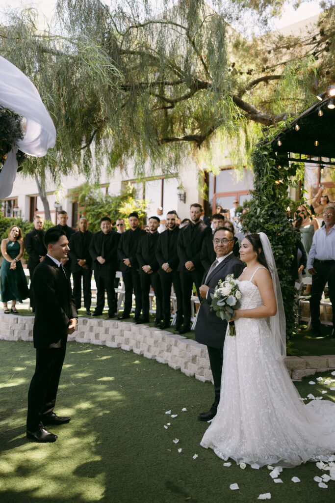 Groom giving away his daughter at the altar