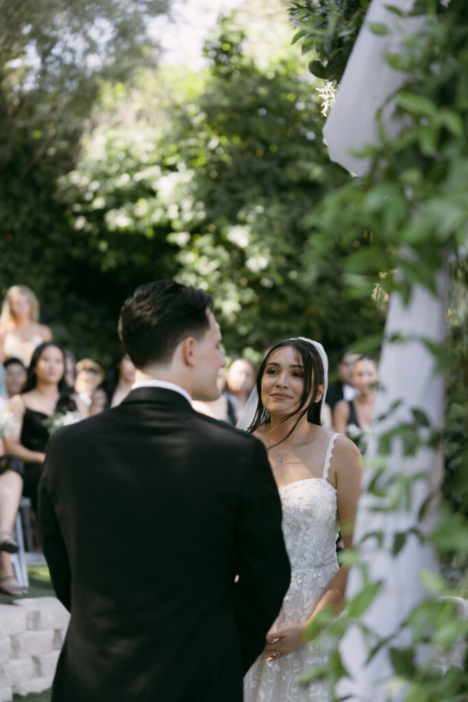 Bride looking at her groom during their Lakeside Weddings and Events Las Vegas wedding ceremony