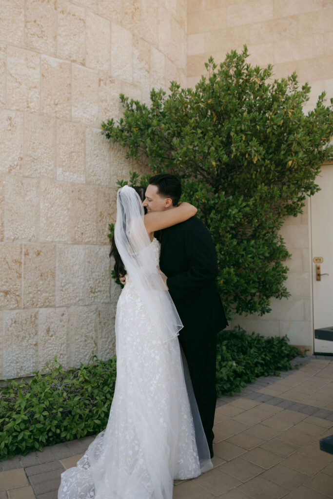 Bride and groom hugging during their first look