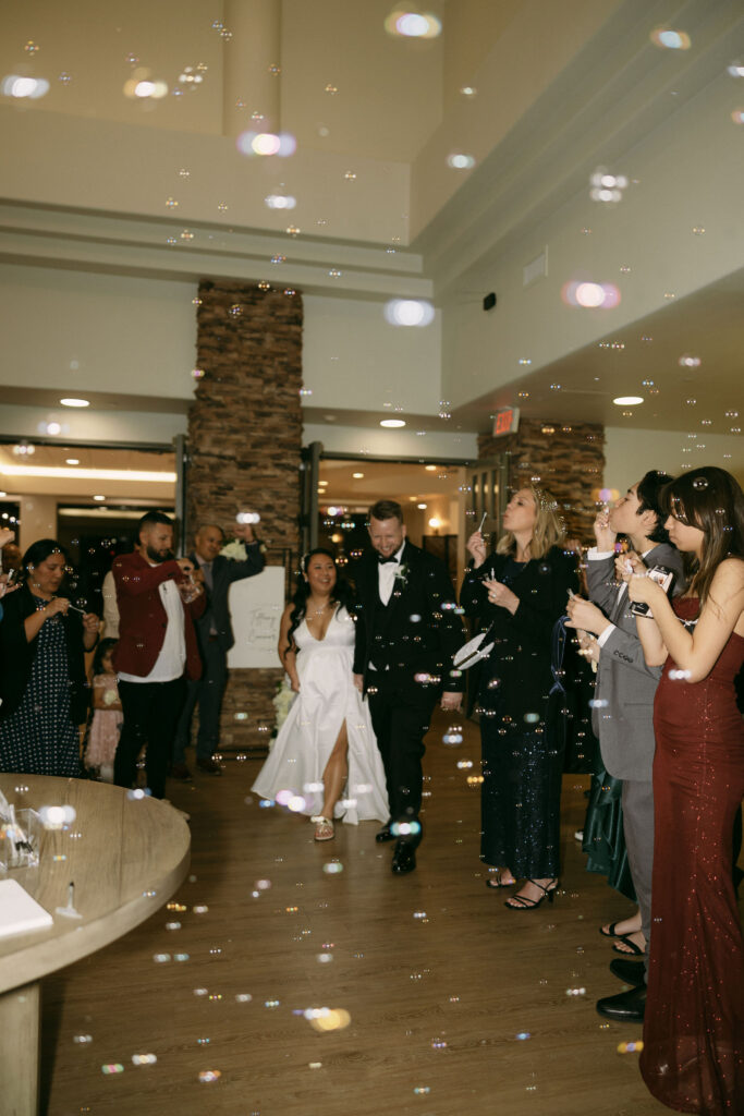 Bride and grooms bubble wedding exit